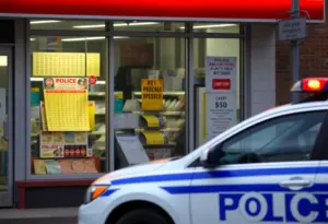 Scene of a convenience store investigation for lottery fraud