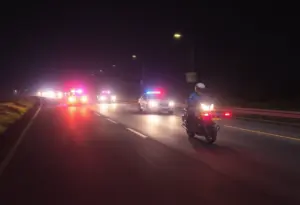 Nighttime police motorcycle chase scene