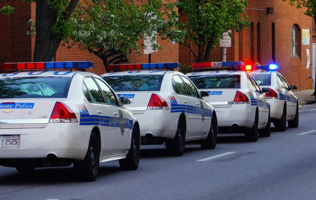 Police patrol car with emergency lights on a roadway