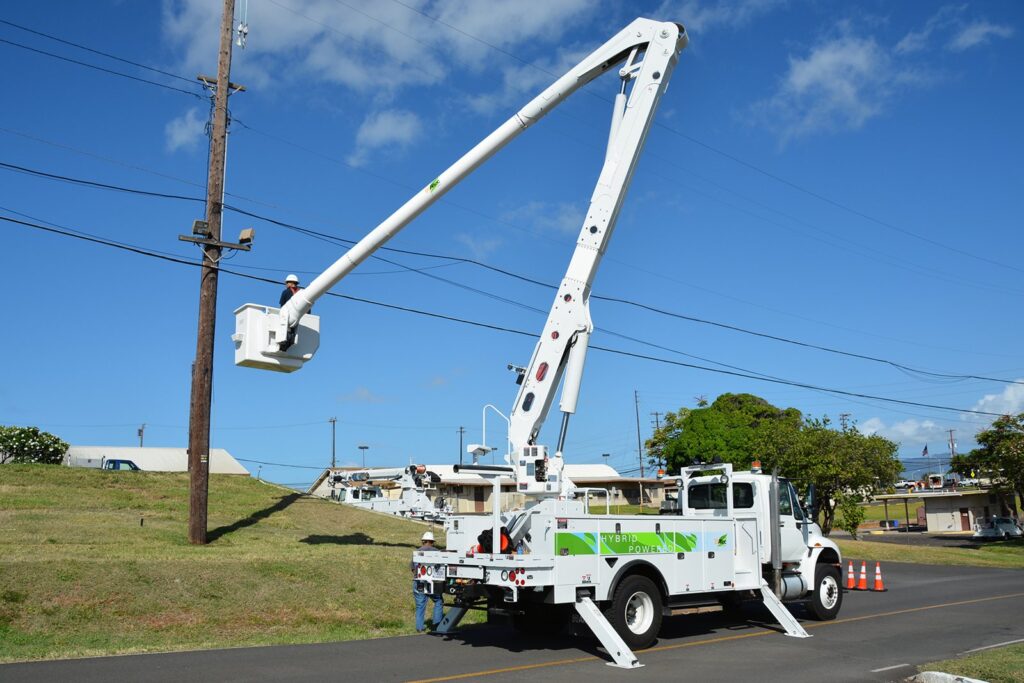 Utility bucket truck working on power lines